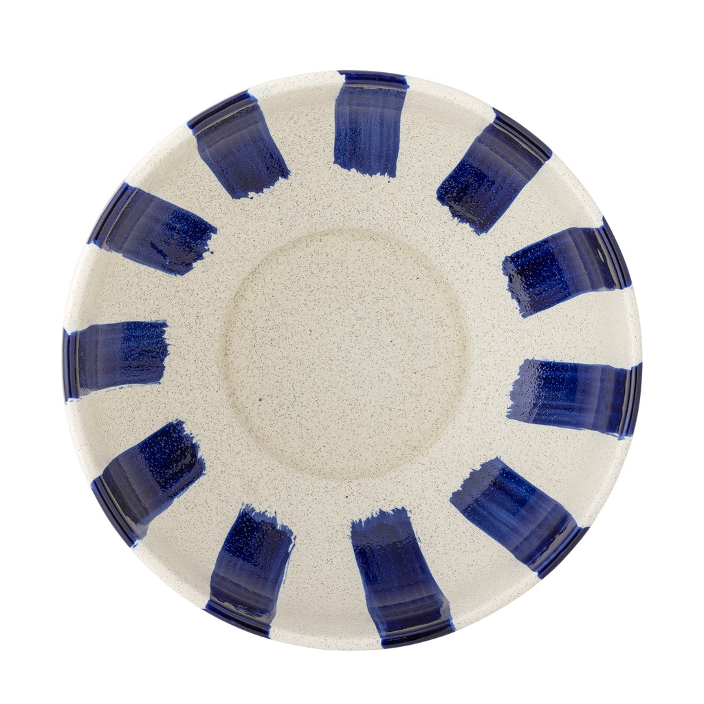 Ceramic plate with blue abstract designs on a white background
