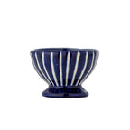 Blue ceramic bowl with white stripes on a white background