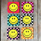 Smiley Coasters on a Checkerboard background. Designed by Love Frankie