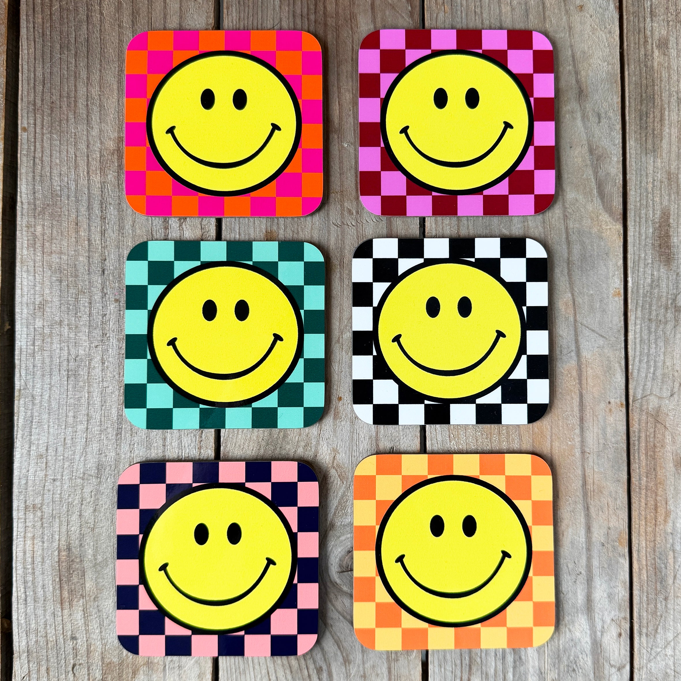 Smiley Coasters on a Checkerboard background. Designed by Love Frankie