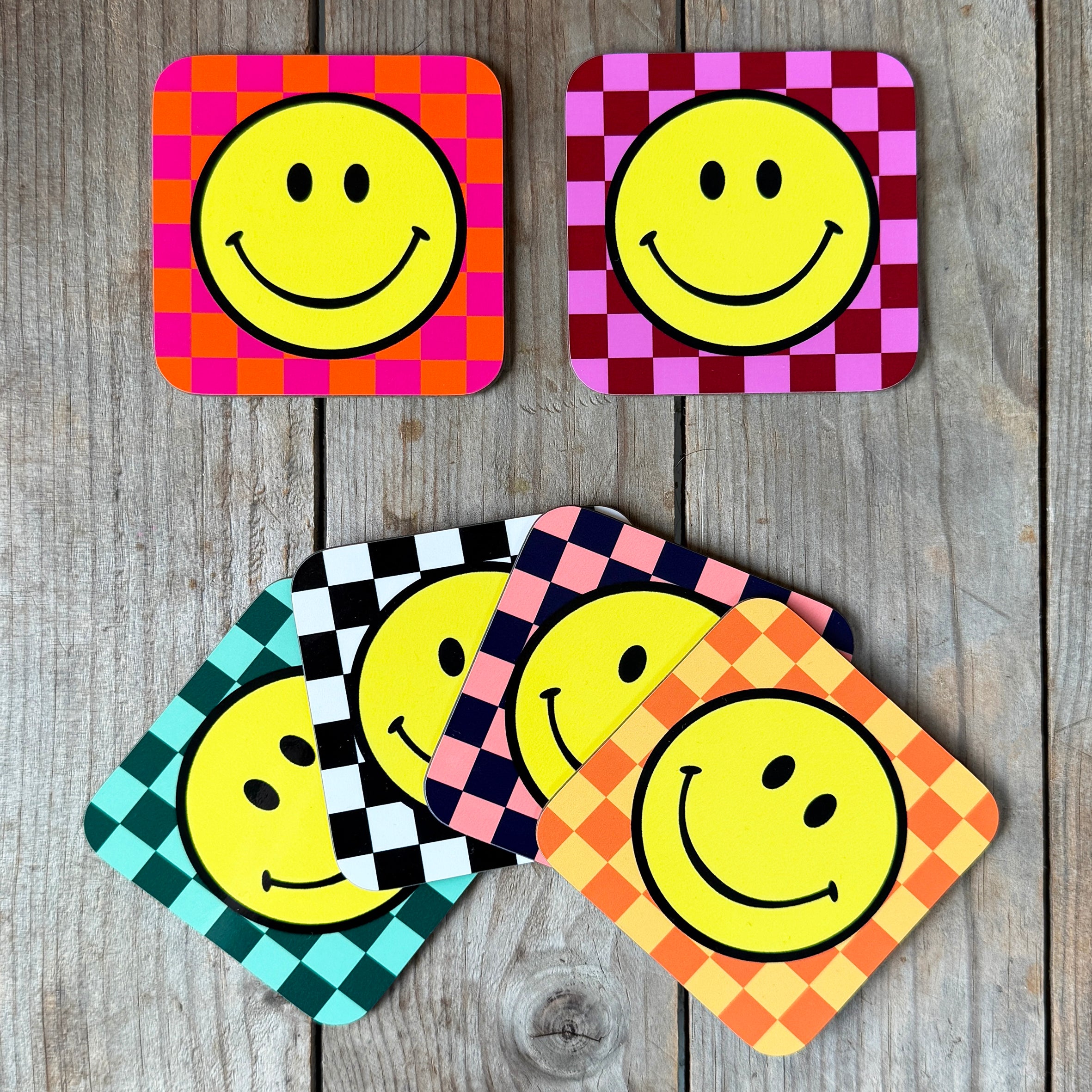 Smiley Coasters on a Checkerboard background. Designed by Love Frankie