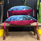 DEADLY NIGHT SHADE CUSHION IN SMOKE WITH RASPBERRY PIPING – MEDIUM