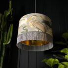 The Tranquil Bird Song Heron Lampshade With Fringing And Gold Lining