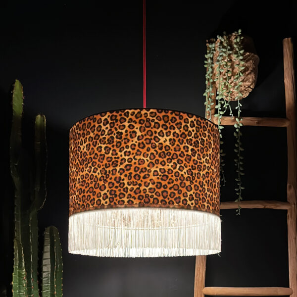 Crisp White Leopard Print Silhouette Lampshade with White Fringing with the light on