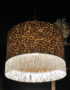 Crisp White Leopard Print Silhouette Lampshade with White Fringing with the light on