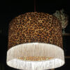 Crisp White Leopard Print Silhouette Lampshade with White Fringing with the light on