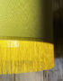 Love Frankie banana cotton lampshade gold lining and fringing light on