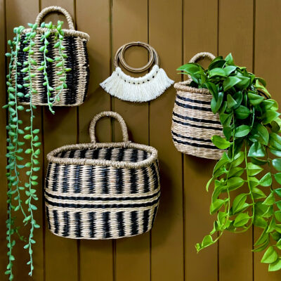 Seagrass striped wall baskets hanging on retro brown wall