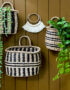 Seagrass striped wall baskets hanging on retro brown wall