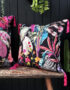 Love Frankie acid jungle velvet cushion with raspberry tassels