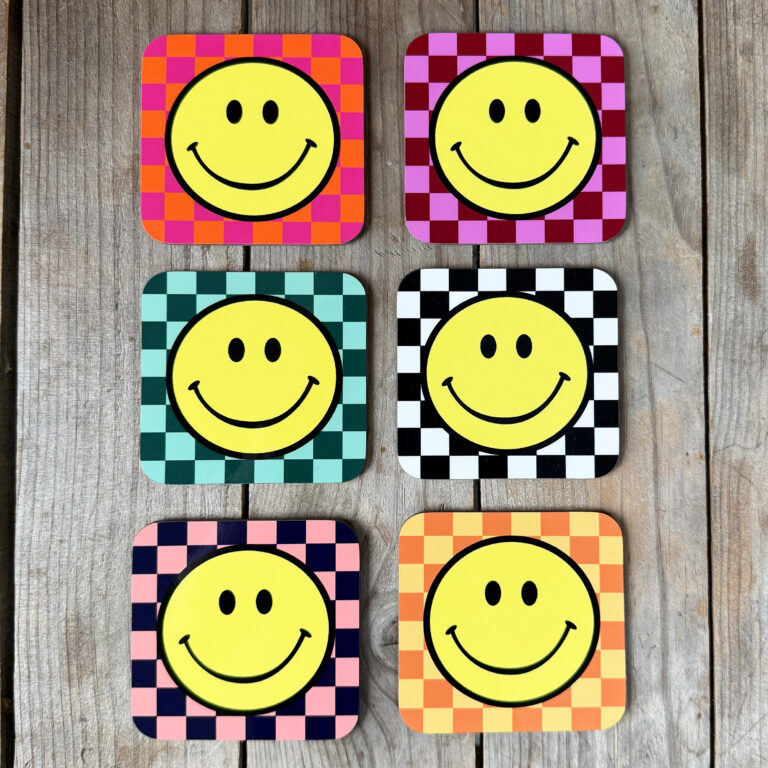 Smiley Coasters on a Checkerboard background. Designed by Love Frankie