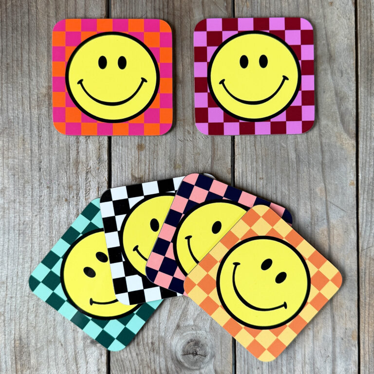 Smiley Coasters on a Checkerboard background. Designed by Love Frankie