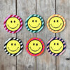 Smiley Coasters on a Striped background. Designed by Love Frankie